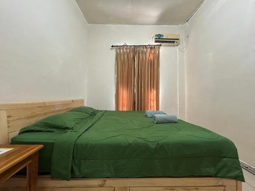 Katil atau katil-katil dalam bilik di FOUR-G Home Stay & Komodo Tour