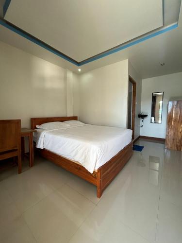 Katil atau katil-katil dalam bilik di FOUR-G Home Stay & Komodo Tour