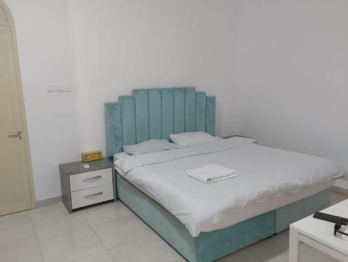 Postel nebo postele na pokoji v ubytování EK Homes