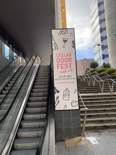 an escalator with a sign that saysller door test at Guest Suite in Marino in Marino