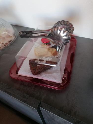 a plate with a piece of cake on a table at Villa Gabry in Capo dʼOrlando