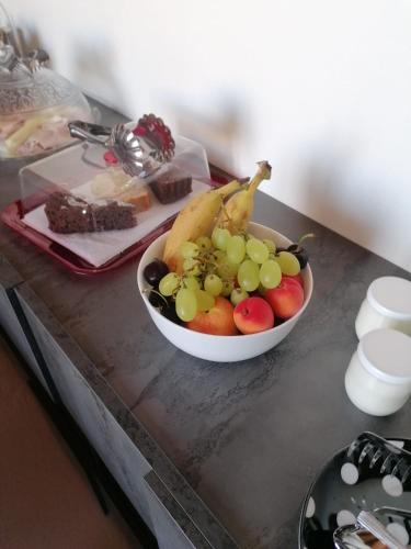 a bowl of fruit sitting on a table at Villa Gabry in Capo dʼOrlando
