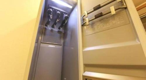 a refrigerator with its door open in a kitchen at H Hotel in Ulsan