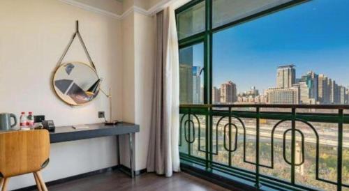 a room with a large window with a view of a city at ibis xian North Second Ring Weiyang Rd Hotel in Xi'an