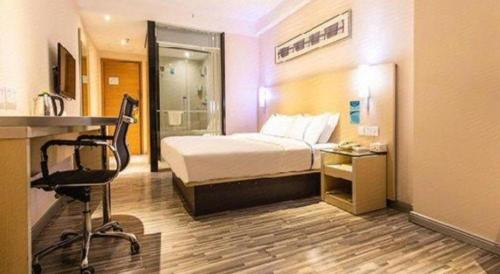 Postel nebo postele na pokoji v ubytování City Comfort Inn Beihai Hepu Bus Terminal