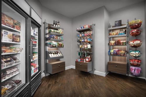 a store room with two refrigerators and food at Homewood Suites by Hilton San Jose Airport-Silicon Valley in San Jose