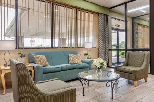 a living room with a couch and chairs and a table at Quality Inn Mount Airy Mayberry in Mount Airy