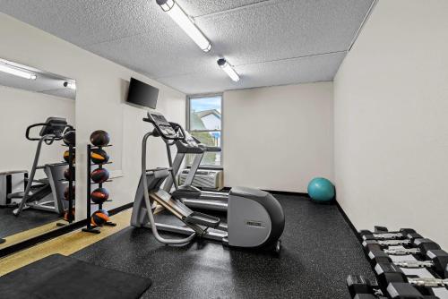 a gym with a treadmill and exercise equipment at Quality Inn Bangor Airport in Bangor