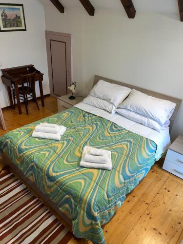 Postel nebo postele na pokoji v ubytování Casa Patty - Liariis of Ovaro CARNIA
