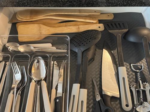 a drawer filled with lots of kitchen utensils at Fribourg Studio Home in Fribourg