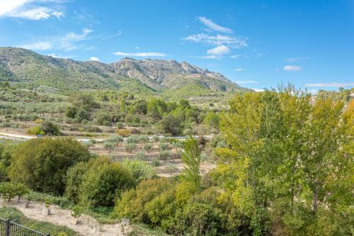a view of a valley with mountains in the background at Hotel Rural Serrella in Castell de Castells