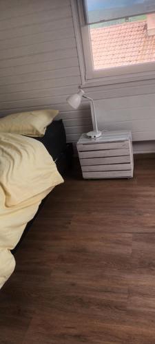 a bedroom with a bed and a window at G mi cabaña in La Celle-sous-Gouzon
