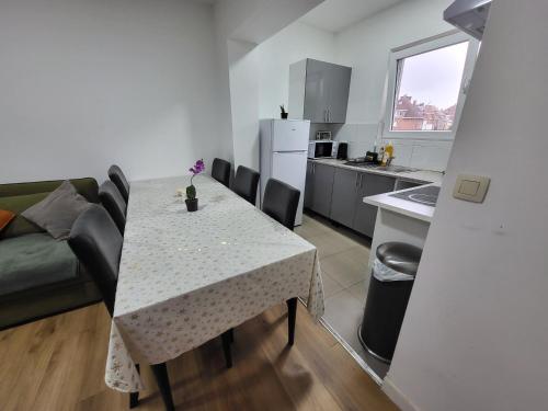 a kitchen and dining room with a table and chairs at Charles House in Brussels