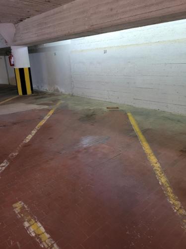 an empty parking lot in a parking garage at Panoramico Eur in Rome