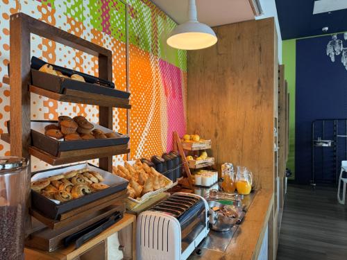 a bakery with various types of bread and pastries at ibis budget Leeds Centre Crown Point Road in Leeds