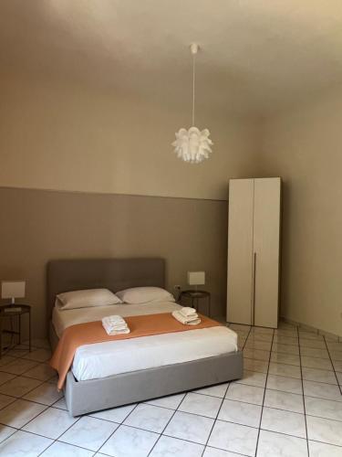 Ένα ή περισσότερα κρεβάτια σε δωμάτιο στο Le Muse apartment