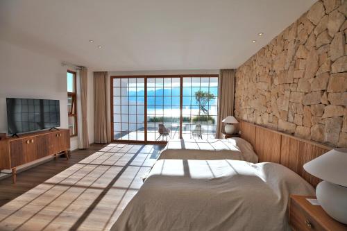 Katil atau katil-katil dalam bilik di Chunshan Sea View Suite Hotel