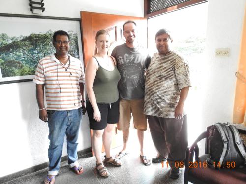 a group of four people standing in a room at Serenity in Kandy