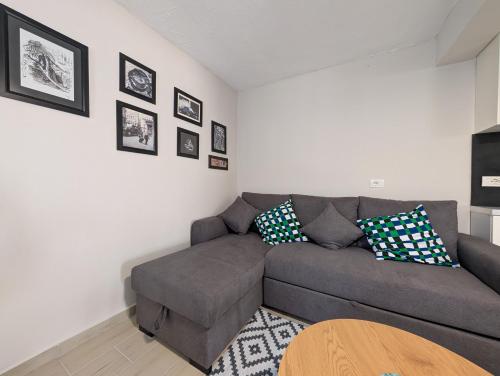 a living room with a couch and a table at Luxury House California 1 in Himare