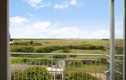 a view of a field from a window at 3 Bedroom Amazing Home In Harboøre in Harboør