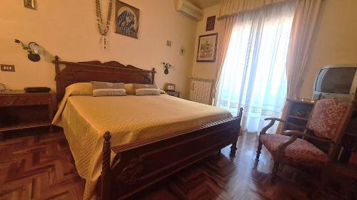 Postel nebo postele na pokoji v ubytování Casa Vacanze da NONNA ANNA