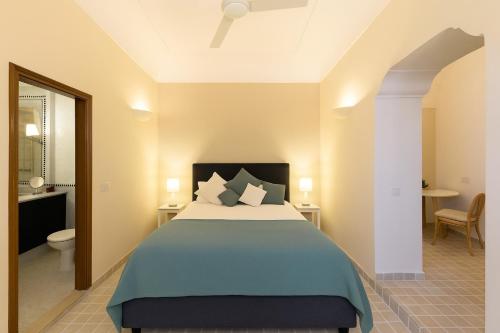 Postel nebo postele na pokoji v ubytování VivimiHome - Suite a pochi passi dalla Piazzetta
