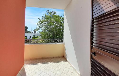 a hallway with a door and a balcony at Cozy Home In Lendinuso With Wifi in Lendinuso
