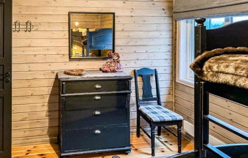 a bathroom with a dresser and a mirror and a chair at 2 Bedroom Lovely Home In Nesbyen in Nesbyen