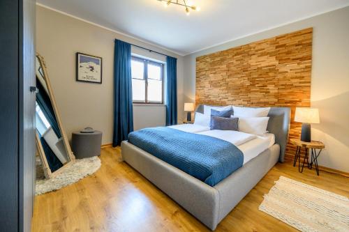 Postel nebo postele na pokoji v ubytování Das Bergquartier - Ferienwohnung Rabenkopf