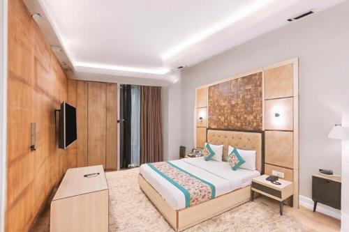 Postel nebo postele na pokoji v ubytování HOTEL CORPORATE PLAZA TERMINAL 3 Delhi AIRPORT