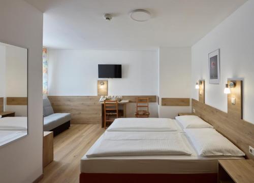 Ein Bett oder Betten in einem Zimmer der Unterkunft Hotel Terminus