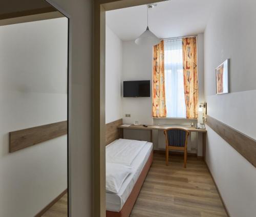 Ein Bett oder Betten in einem Zimmer der Unterkunft Hotel Terminus