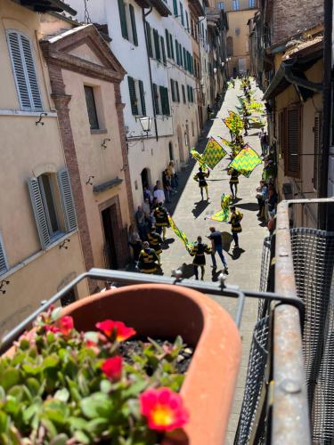 a group of people walking down a street at Loft 47 in Siena