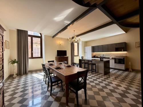 a kitchen and dining room with a table and chairs at Dimora Santa Chiara in Ripatransone