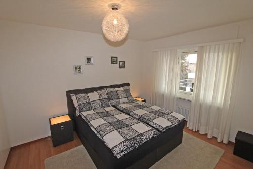 Ένα ή περισσότερα κρεβάτια σε δωμάτιο στο Condominio Panorama, 2 5-Zimmerwohnung by HolAp SA