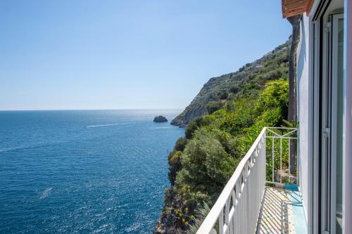 a view of the ocean from a balcony of a building at Hotel Costa Diva in Praiano