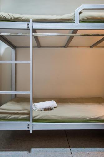 a couple of bunk beds in a room at Banthat Thong Hostel in Bangkok