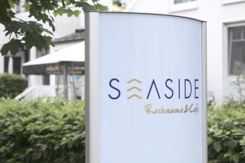 a sign for a aside architectural shop at Ferienwohnung Katja in der Villa Seeblick in Bad Saarow
