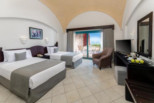 Voodi või voodid majutusasutuse Swisstouch Resort Marsa Alam toas