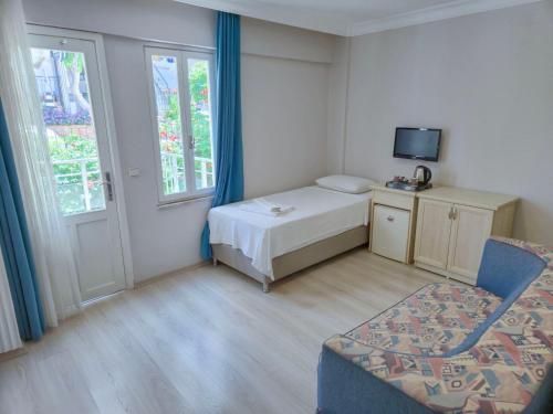 Katil atau katil-katil dalam bilik di Habesos Hotel
