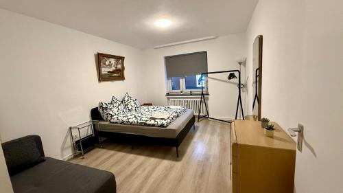 a living room with a couch and a chair at Wu Stay in Wuppertal