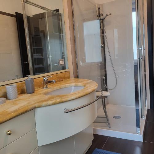 a bathroom with a sink and a shower at Residenza Magenta in Legnano