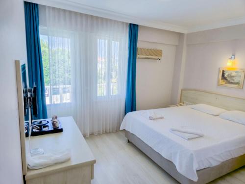 Katil atau katil-katil dalam bilik di Habesos Hotel