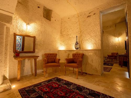 Un lugar para sentarse en Tulip Cave Suites