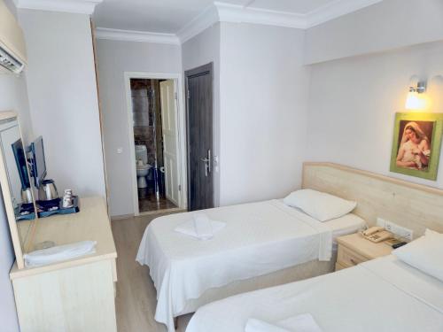 Katil atau katil-katil dalam bilik di Habesos Hotel