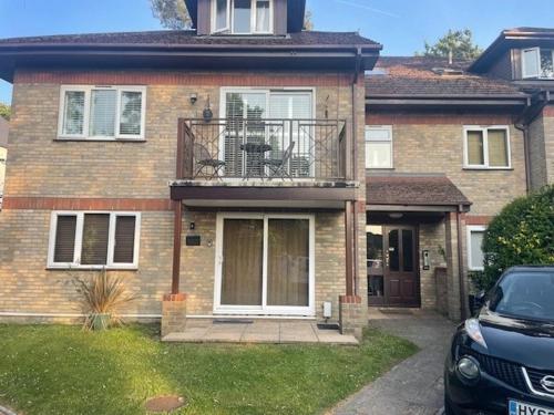 a house with a car parked in front of it at Number One - Inglewood in Parkstone