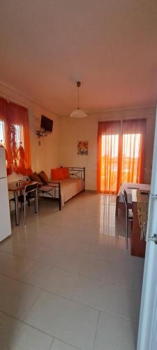 a living room with a couch and a table at Golden Sun Apartments in Rovies