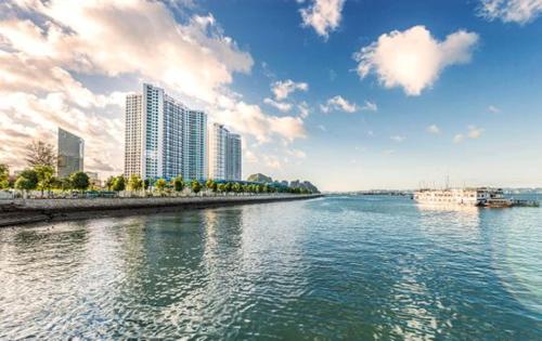a large body of water with buildings in the background at Căn hộ studio 38m2 The Sapphire S2-0802 in Ha Long