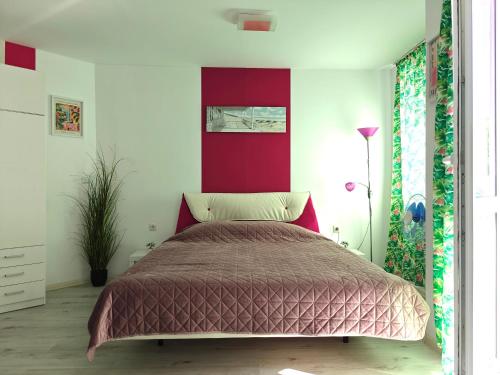 En eller flere senge i et værelse på Studio Viktoria