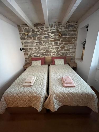 Ένα ή περισσότερα κρεβάτια σε δωμάτιο στο FELIZA Apartment